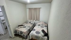 Postel nebo postele na pokoji v ubytování Casa Curicó Viñedos