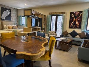 a living room with a wooden table and a couch at Castello di Carlo - Loft Carlo II in Santeagueda