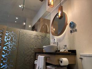 a bathroom with a sink and a mirror at Castello di Carlo - Loft Carlo II in Santeagueda +8 photos