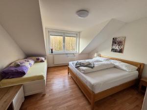 Ένα ή περισσότερα κρεβάτια σε δωμάτιο στο Apartman pod Smokovcom