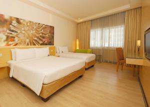Postel nebo postele na pokoji v ubytování ANSA Hotel Kuala Lumpur