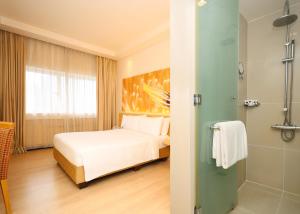 Postel nebo postele na pokoji v ubytování ANSA Hotel Kuala Lumpur
