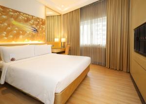 Postel nebo postele na pokoji v ubytování ANSA Hotel Kuala Lumpur