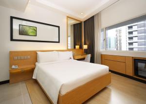 Postel nebo postele na pokoji v ubytování ANSA Hotel Kuala Lumpur