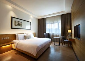 Postel nebo postele na pokoji v ubytování ANSA Hotel Kuala Lumpur