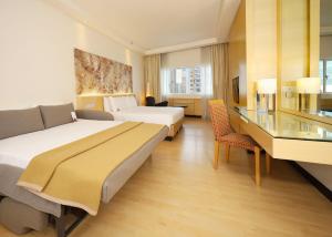 Postel nebo postele na pokoji v ubytování ANSA Hotel Kuala Lumpur