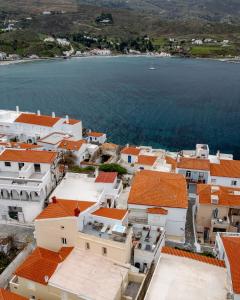 an aerial view of a town with the water at Castel Abaso Boutique Apartments by Explore Andros in Andros
