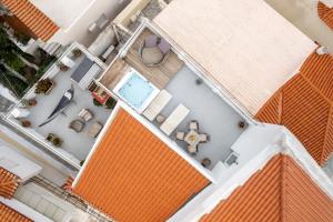 an overhead view of a house with an orange roof at Castel Abaso Boutique Apartments by Explore Andros in Andros