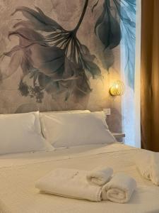 Postel nebo postele na pokoji v ubytování Via del Mare Apulia B&B e Spa Suites