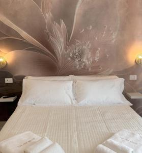 Postel nebo postele na pokoji v ubytování Via del Mare Apulia B&B e Spa Suites
