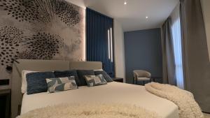 A bed or beds in a room at Sercotel Princesa De Eboli