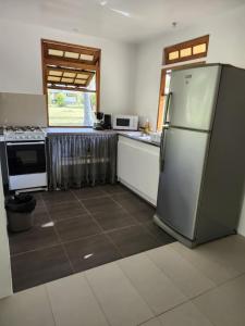Kuchyň nebo kuchyňský kout v ubytování Rangiroa Guest Paradise