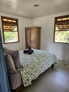 Postel nebo postele na pokoji v ubytování Rangiroa Guest Paradise