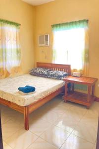 Postel nebo postele na pokoji v ubytování Larosa Hostel Puerto Princesa + 29 fotografií
