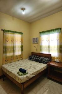 Postel nebo postele na pokoji v ubytování Larosa Hostel Puerto Princesa