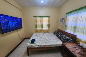 Postel nebo postele na pokoji v ubytování Larosa Hostel Puerto Princesa