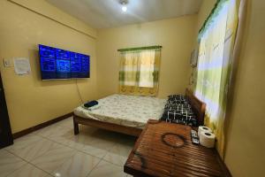 Postel nebo postele na pokoji v ubytování Larosa Hostel Puerto Princesa