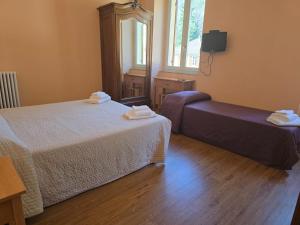 Postel nebo postele na pokoji v ubytování Albergo Minetto