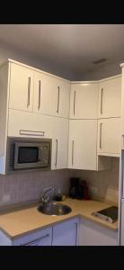 A kitchen or kitchenette at PLENO CENTRO DE SEVILLA- JUNTO IGLESIA MONTESIÓN
