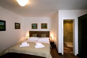 Postelja oz. postelje v sobi nastanitve Apartmány Šupina