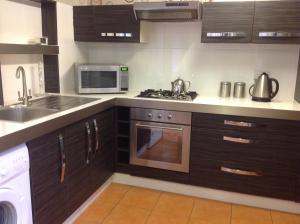A kitchen or kitchenette at The Guest Wing 