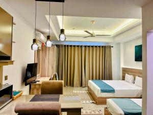 a hotel room with a bed and a desk at Negombo Ocean Breeze Luxury Studio by Serendib Vacation in Negombo