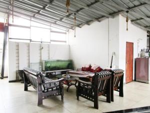 a dining room with a table and chairs in a room at 1 BHK luxury Bedroom Penthouse ,Couple Friendly in Belgaum