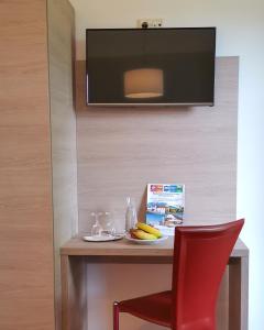 TV a/nebo společenská místnost v ubytování Hotel Am Greiner
