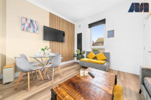 a living room with a table and a couch at 2 Bed Home with Parking Sleeps 4 in Fife