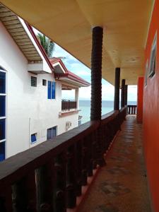 a balcony of a building with a view of the ocean at WJV Inn Beach Resort Camotes in Camotes Islands