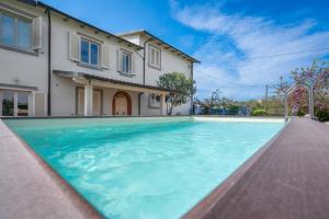 a swimming pool in front of a house at Borgo House In Florentine Hills With Pool in Fucecchio