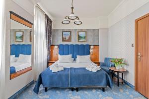 Postel nebo postele na pokoji v ubytování Hotel Diament Plaza Gliwice