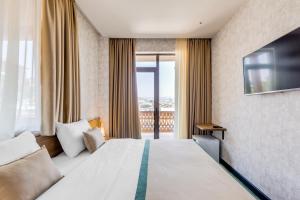 Postel nebo postele na pokoji v ubytování Sole Palace
