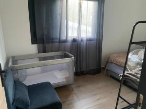 Postel nebo postele na pokoji v ubytování O coeur de l'ouest Bungalow Maloya