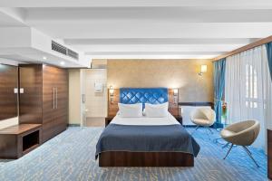 Postel nebo postele na pokoji v ubytování Hotel Diament Plaza Gliwice