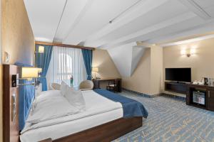 Postel nebo postele na pokoji v ubytování Hotel Diament Plaza Gliwice