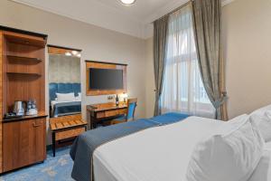 Postel nebo postele na pokoji v ubytování Hotel Diament Plaza Gliwice