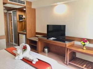 TV a/nebo společenská místnost v ubytování Boutique Paradise Hotel