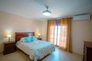 En eller flere senge i et værelse på Villa Ilusión Home