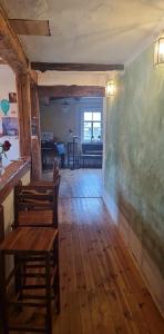a classroom with chairs and a chalkboard on a wall at Gemütliches Fachwerkhaus in Reinhausen +9 photos