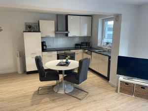 Η κουζίνα ή μικρή κουζίνα στο Ferienwohnung mit Seeblick +7 φωτογραφίες