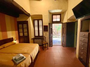 En eller flere senge i et værelse på Casa La Corte