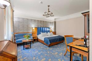 Postel nebo postele na pokoji v ubytování Hotel Diament Plaza Gliwice