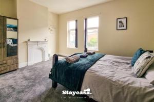 a bedroom with a bed and a fireplace at Clarence Co-living - Private Room Self-cater in Manchester