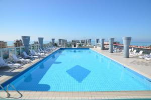 a large swimming pool on the roof of a building at Residenza delle Terme in Bibione +77 photos