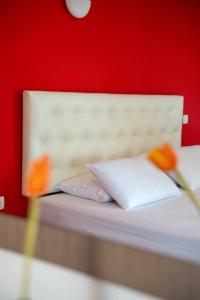Llit o llits en una habitació de Coralli Hotel