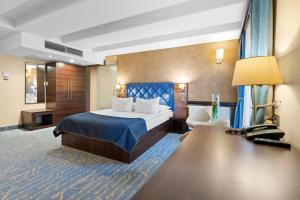 Postel nebo postele na pokoji v ubytování Hotel Diament Plaza Gliwice