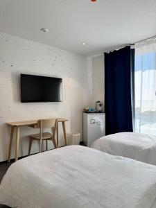 Postel nebo postele na pokoji v ubytování N's Hotel - Self-Check-in Hotel