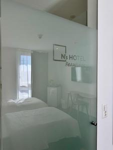 Postel nebo postele na pokoji v ubytování N's Hotel - Self-Check-in Hotel
