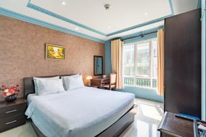 Giường trong phòng chung tại La Bonita Boutique Hotel +37 ảnh